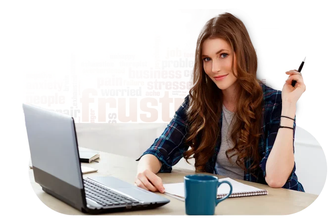 a girl sitting at a table with a laptop