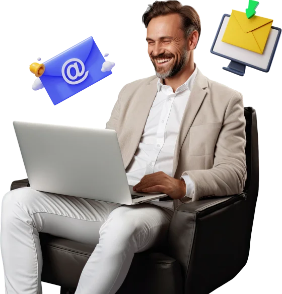 a man sitting in a chair with a laptop